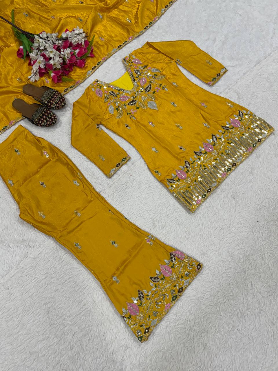 Elegant Rust Orange Silk Kurta and Flared Palazzo Set Adorned with Intricate Multicolored Botanical Embroidery and Mirror Work